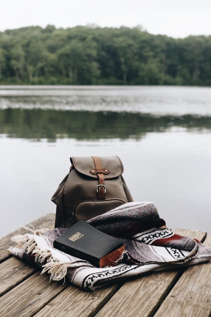 Photo by Jessica Mangano brown leather backpack on brown textile
