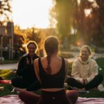 여성 건강관리, 일상 속 작은 변화가 만드는 큰 차이 a group of people sitting on top of a lush green field